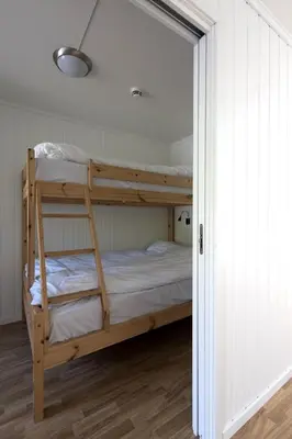 a bedroom with two bunk beds in a room at Skjolden Resort in Skjolden