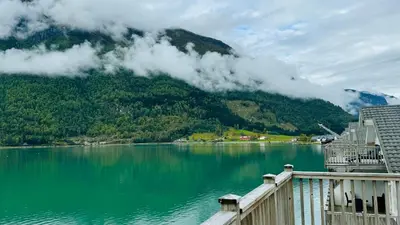 a view of a body of water with a mountain at Skjolden Resort in Skjolden