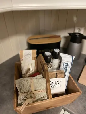 a wooden box filled with different items on a table at Hytte i nydelige Jotunhemen - rett ved Besseggen in Randsverk