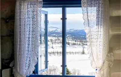a window with a view of a snowy mountain at Amazing Home In Åmotsdal With Kitchen in Åmotsdal