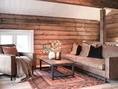 a living room with two couches and a coffee table at 9 person holiday home in Geiranger-By Traum in Geiranger