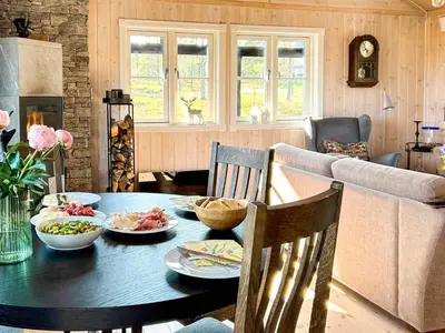 a table with plates of food on it in a living room at 10 person holiday home in veggli-By Traum in Veggli