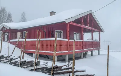 a red house with snow on top of it at Gorgeous Home In Svingvoll With Wifi in Svingvoll