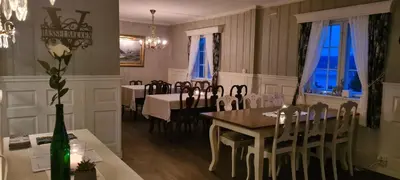 a dining room with a table and chairs at VILLA HASSELBAKKEN in Eidsvoll
