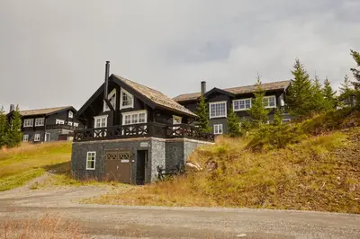 a large house on top of a hill at Hafjell tømmerhytte 4B in Hafjell
