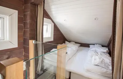 a small room with two beds in a attic at Mosetertoppen Panorama, Anneks 2B - Hafjell in Hafjell