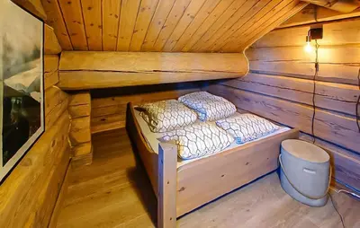 a small cabin with two bunk beds in it at Cozy Home In Sjusjøen With Sauna in Sjusjøen