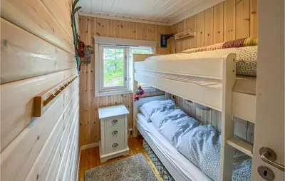 a bedroom with bunk beds in a tiny house at Gorgeous Home In Lillehammer With Wifi in Lillehammer