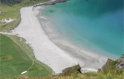 an aerial view of a beach with blue water at 3 Bedroom Awesome Home In Leikanger in Leikanger