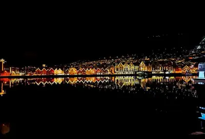 a view of a city at night with a body of water at Floien City House -free parking in Bergen