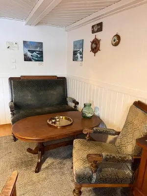 a living room with a coffee table and a couch at Drømmebrygga in Averoy