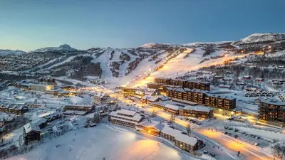 an aerial view of a resort in the snow at Gjestegaarden Leiligheter in Beitostøl