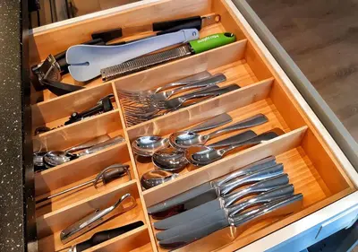 a drawer full of utensils in a kitchen at Ibsens in Bergen