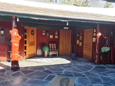 a garage with a table and a chair in it at DaVita Ranch in Tranhaug
