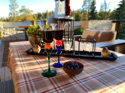 a table with two glasses of wine on a patio at DaVita Ranch in Tranhaug