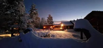 a yard covered in snow in front of a house at DaVita Ranch in Tranhaug