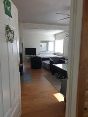 a living room with a couch and a television at Holiday Home in Gol