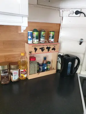 a kitchen counter with a organized pantry with spices at Holiday Home in Gol