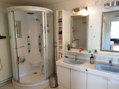 a bathroom with two sinks and a shower at Holiday Home in Gol