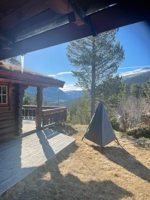 a tent sitting on the porch of a cabin at Timber Lodge in Uvdal Skisenter VIEW/WIFI in Sønstebø