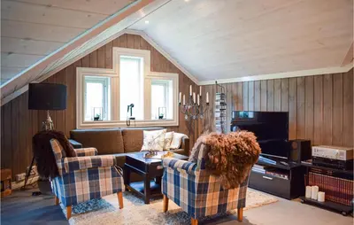 a living room with two couches and a tv at Lovely Home In Vossestrand With Wifi in Vossestrand