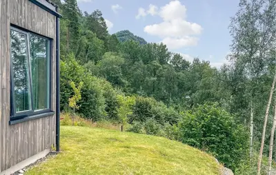 a house with a window on the side of it at 4 Bedroom Nice Home In Stangvik in Stangvik