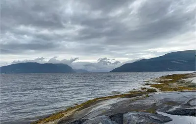 a large body of water with mountains in the background at 4 Bedroom Nice Home In Stangvik in Stangvik