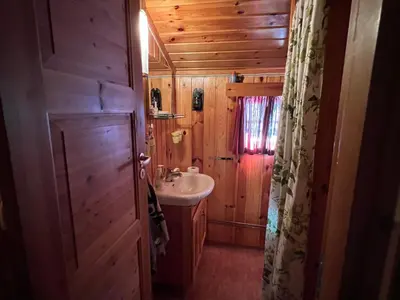 a bathroom with a sink and a toilet in a cabin at Beitos hjemmekoselige in Beitostøl