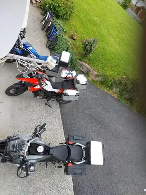 a group of motorcycles parked on the side of a street at Ålesund Apartment with free parking in Ålesund