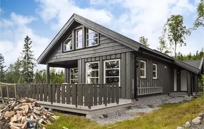 a small house with a wooden fence in front of it at 4 Bedroom Pet Friendly Home In Eggedal in Eggedal