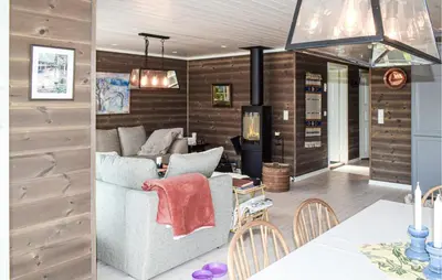 a living room with a couch and a fireplace at 4 Bedroom Pet Friendly Home In Eggedal in Eggedal