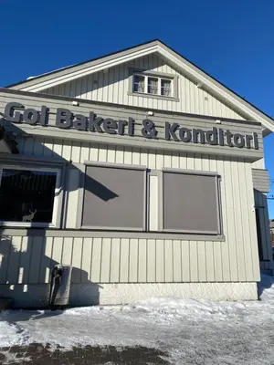 a building with a sign that reads got bakery and kordination at ! Perfect Snow Condition! Beautiful Apartment at Skagahøgdi with Panoramic View in Gol