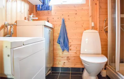 a bathroom with a toilet and a sink at Beautiful Home In Vossestrand With Wifi in Vossestrand