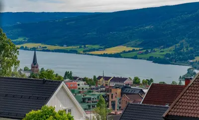a view of a town with a lake in the distance at Sanns villa in Lillehammer