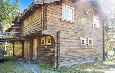 a log cabin with a window on the side of it at Låven in Rauland
