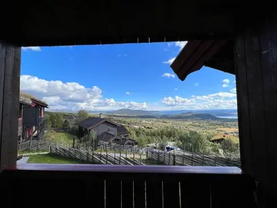 a view from a window of a farm house at Bjødnabakkens fjellutsikt in Beitostøl