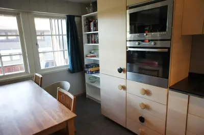 a kitchen with a table and a microwave at Spacious 2-bedroom holiday apartment - Hemsedal Veslehorn 14 in Hemsedal