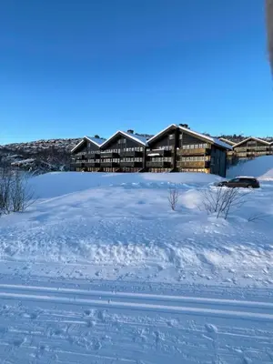 a house in the snow with a lot of snow at Beitotind sentralt på Beitostølen in Beitostøl