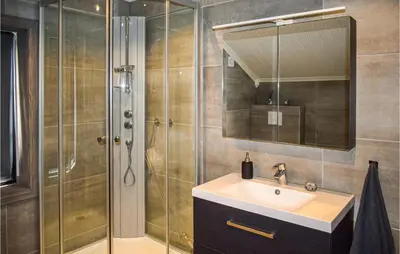 a bathroom with a sink and a shower at Stunning Home In Rauland With Sauna in Rauland
