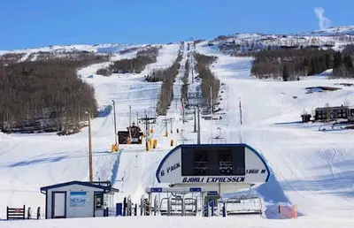 a ski resort with a ski lift in the snow at Bjorli Apartment 203 (200m til Skitrekk) in Bjorli