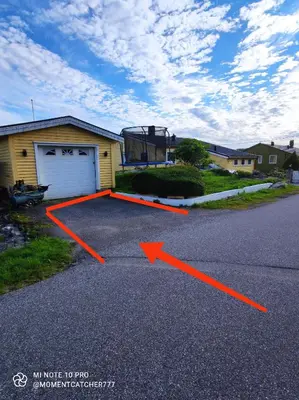 an image of a driveway with an arrow pointing to a garage at Guest room in private house in Ålesund