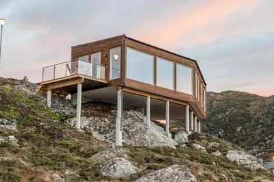 a house on top of a mountain at Runde Panorama - Trollvogga in Runde