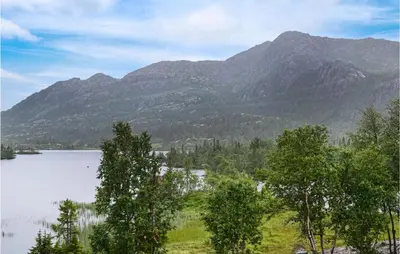a view of a mountain with a lake and trees at Cozy Home In Rjukan With Kitchen in Rjukan