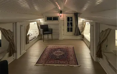 a room with a bed and a rug on a floor at Beautiful Home In Rauland With Sauna in Rauland