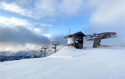 a ski lift on top of a snow covered slope at Awesome Home In Rauland With Wifi in Rauland