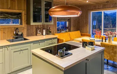 a kitchen with a sink and a stove top oven at Awesome Home In Rauland With Wifi in Rauland
