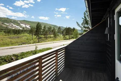 a balcony with a view of a road at Flott leilighet i Vestlia - ski in/ski out in Geilo