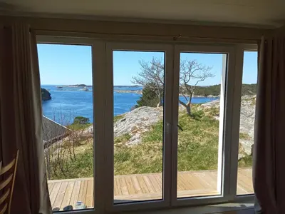 a window with a view of the ocean at Apartment , Øygarden, Bergen in Torsteinsvik