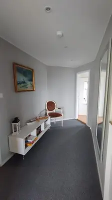 a white room with a table and a chair at Apartment , Øygarden, Bergen in Torsteinsvik