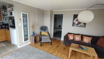 a living room with a couch and a chair at Apartment , Øygarden, Bergen in Torsteinsvik